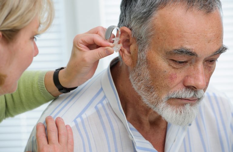 Fitting a hearing aid into the ear